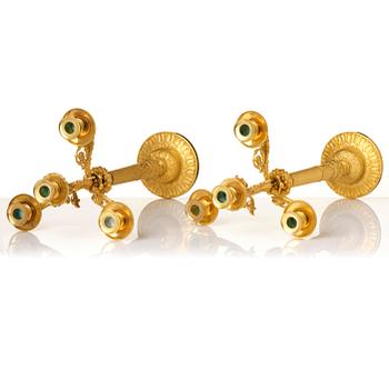 A pair of French Empire four-light gilt bronze candelabra, early 19th century.