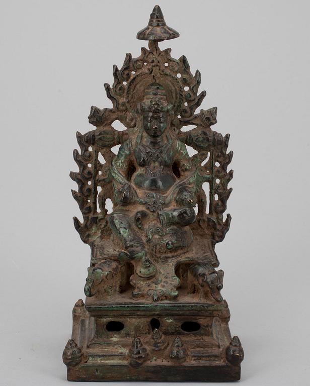 FIGURIN, grönpatinerad mässing, Kubera, Sydostasien 1900-talets senare hälft.