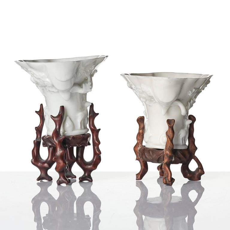 A pair of blanc de chine rhinoceros libation cups, Qing dynasty, Kangxi (1662-1722).