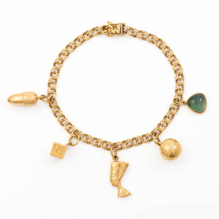 Bracelet 18K gold with five charms.
