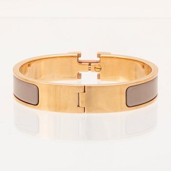 Hermès, "Clic H" bracelet in enamel with rose gold-plated hardware.