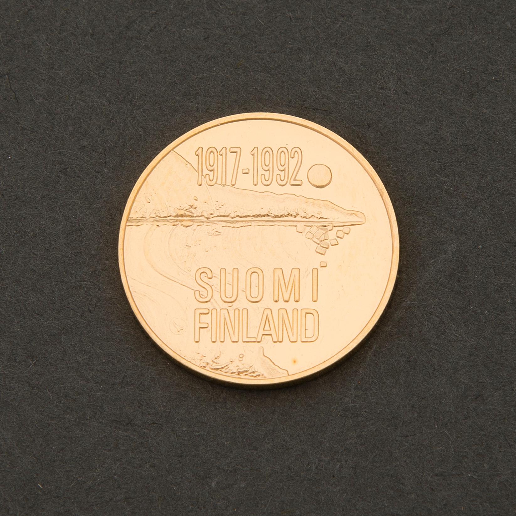 A Finnish gold .900 commemorative coin, 1000 mk, Finland 75 years.