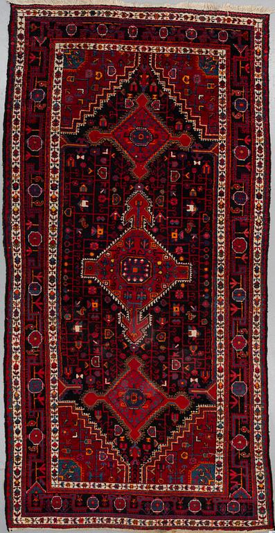 A CARPET Old West Persian, around 334 x 168 cm.