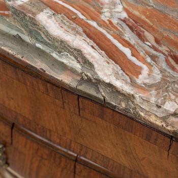 A 19th Century rococo style chest of drawers.