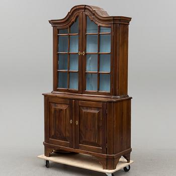 A 20th century rococo style display cabinet.