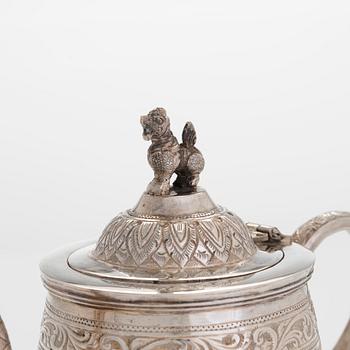 A silver teapot, China.