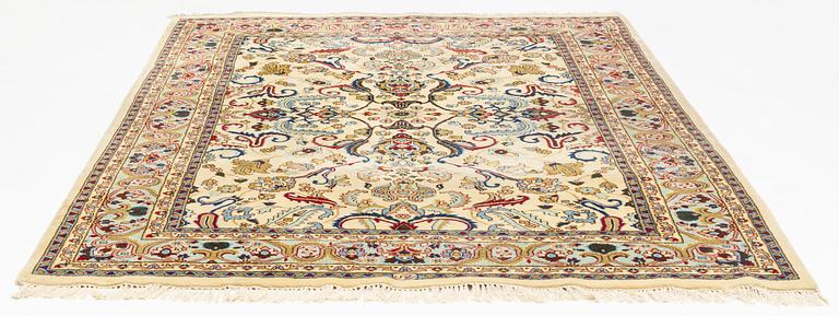 A carpet, signed, circa 286 x 212 cm.