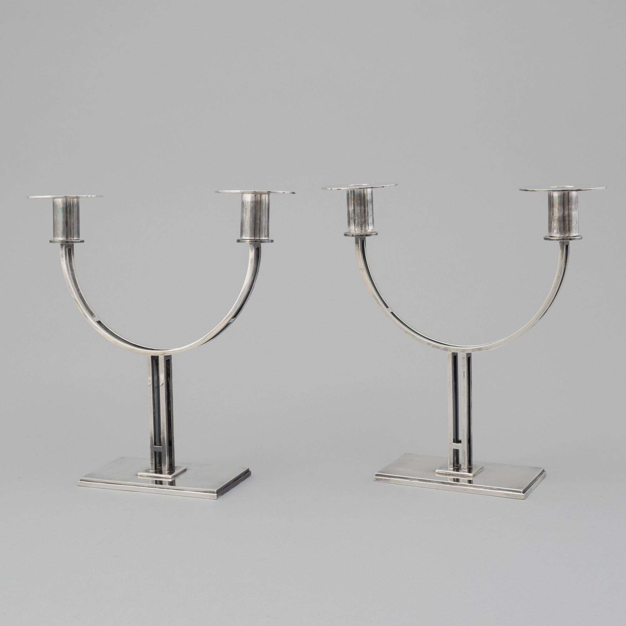 A pair of Klas-Göran Tinbäck two light sterling silver candelabra. Stockholm, 1989.