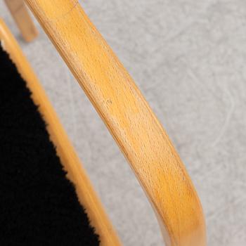 Yngve Ekström, an armchair and a footstool, "Lamino", Swedese, second half of the 20th century.