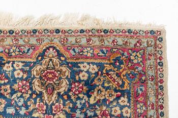A carpet, Kerman, ca 323 x 213 cm.