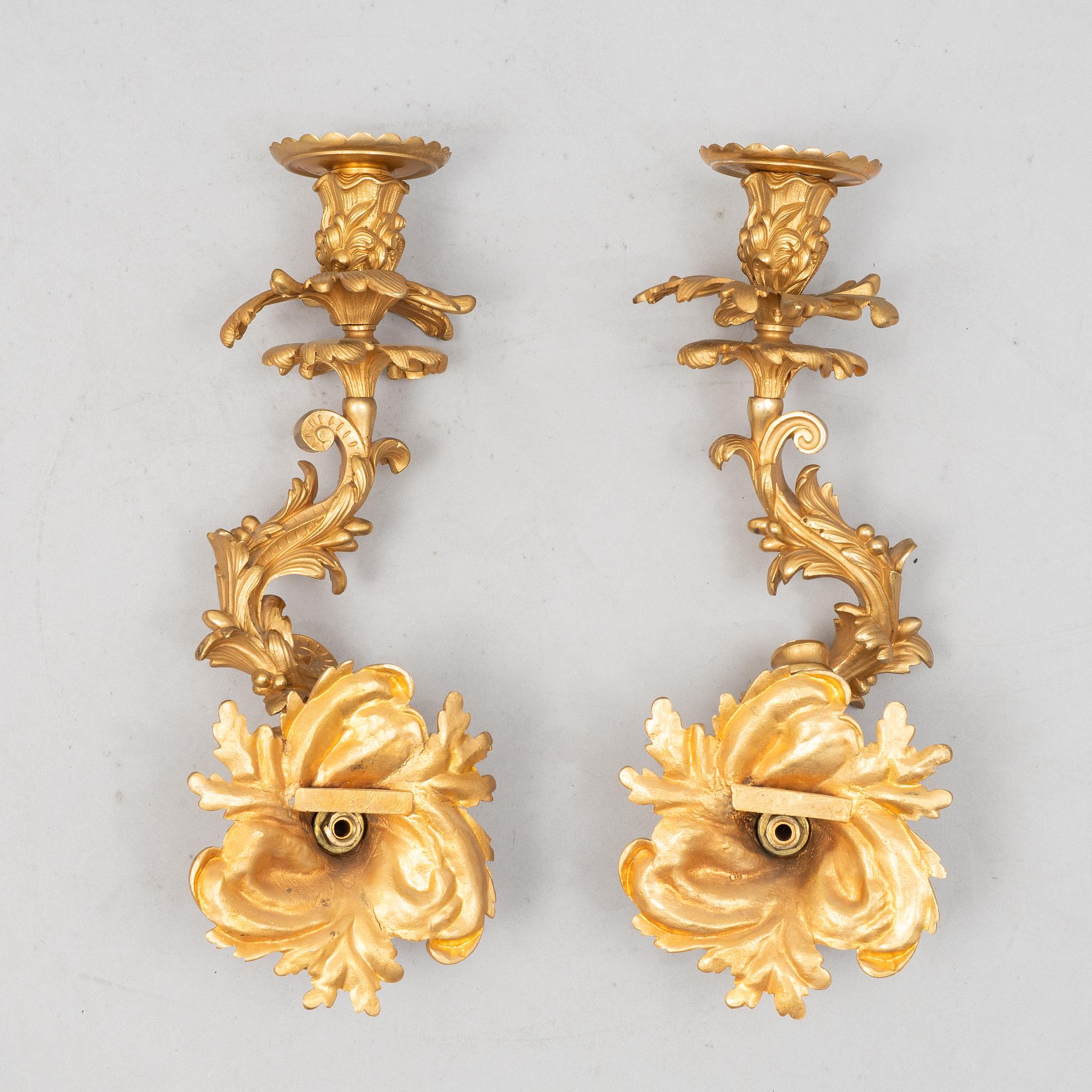 A pair of Louis XV sconces, early 20th century.