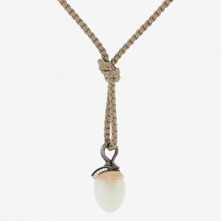 Ole Lynggaard, pendant, "Lotus", gold and silver with small brilliant-cut diamonds and likely moonstone.