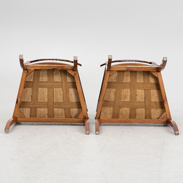 A pair of Swedish Empire mahogany open armchairs, early 19th century.