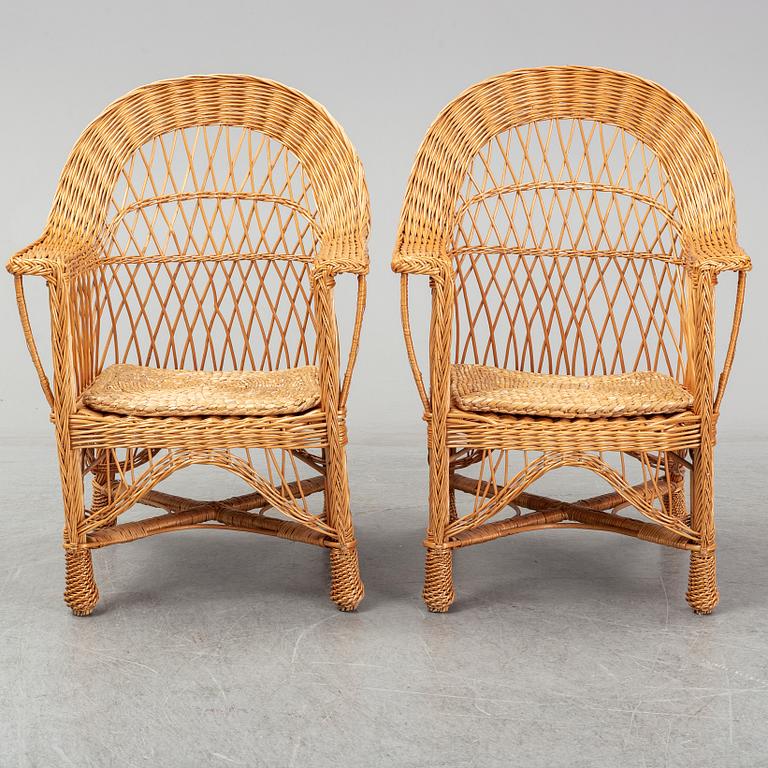 A pair of 1970s/1980s rattan armchairs.