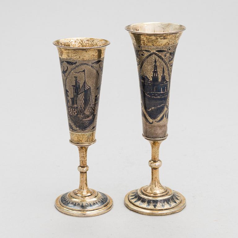 Two gilt silver and niello champagne flutes, Moscow 1842 and 1844. Unidentified maker's mark AK.