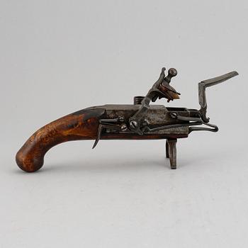 A 18th Century Flintlock lighter.