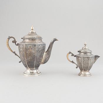 A persian silver coffee-pot and creamer, Iran Isfahan, late Pahlavi dynasty.