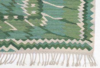 Barbro Nilsson, a carpet, 'Strålblomman grön', tapestry weave, c. 316 x 232 cm, signed AB MMF BN.