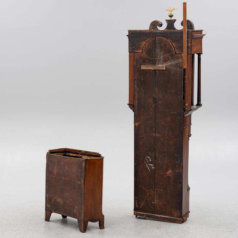 A long-case clock, England, 19th century.