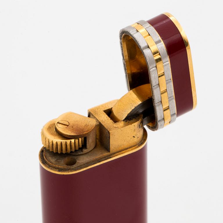 A Cartier lighter and pen.