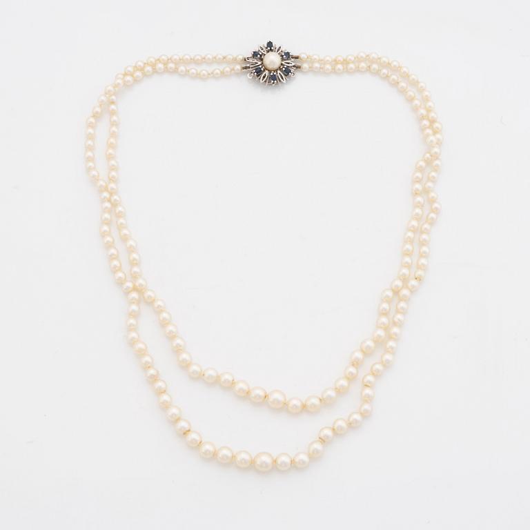 Cultured pearl necklace, clasp 18K white gold.