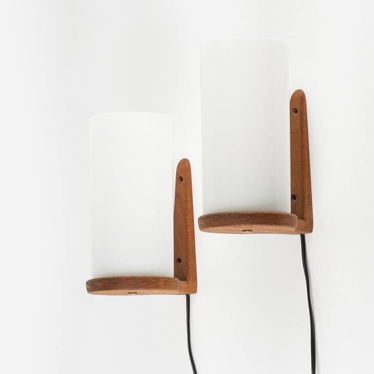 Uno & Östen Kristiansson, a pair of teak and acrylic wall lights, Luxus, Vittsjö.