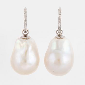 Cultured baroque pearl and diamond earrings.