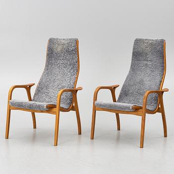 Yngve Ekström, A pair of armchairs, a footstool, “Lamino”, and a side table, Swedese, 2000s.