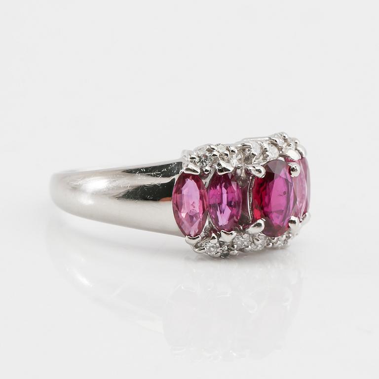 Ring in 850 platinum with navette-cut pink sapphires and round brilliant-cut diamonds.