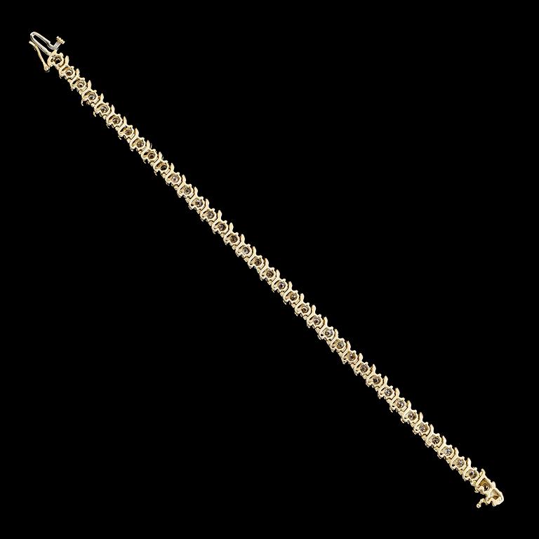 ARMBAND, 14 k guld, briljantslipade diamanter tot ca 5.40 ct.