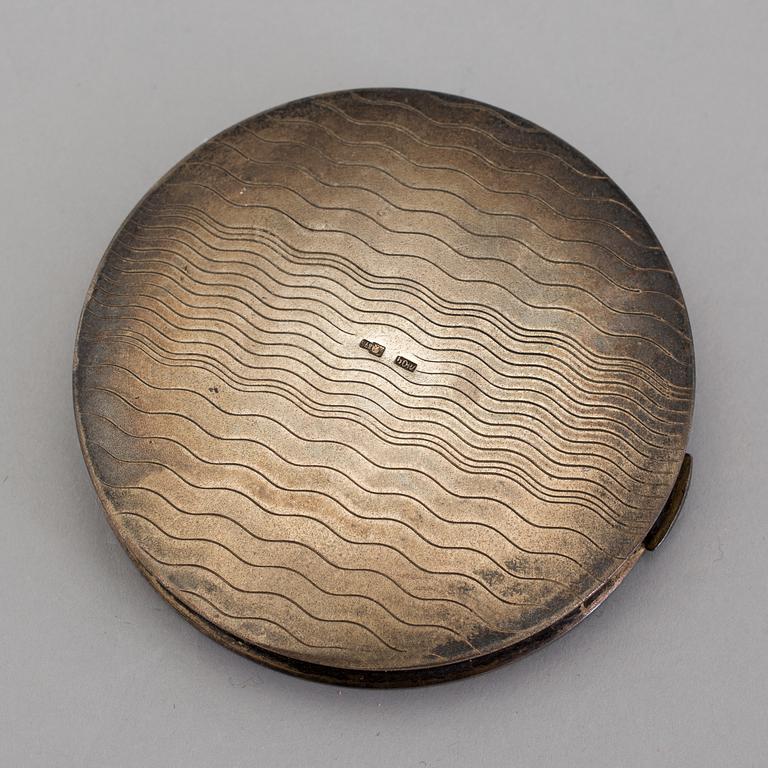 a russian silver powder compact from the first half of the 20th century.