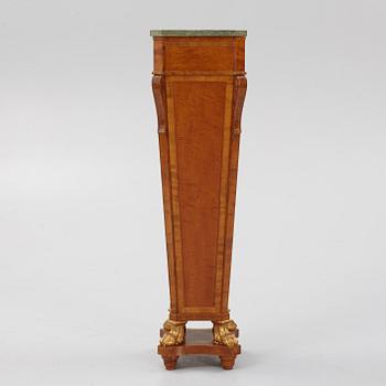 A Louis XVI-style pedestal, early 20th century.