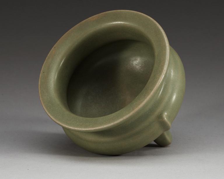 A celadon glazed tripod censer, Ming dynasty.