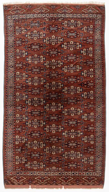 An antique Youmut main carpet, c. 330 x 183 cm.