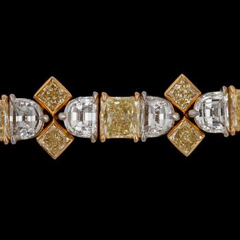 A Fancy Yellow and colourless diamond, total carat weight 23.16 cts, bracelet.