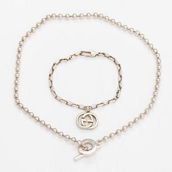 Gucci, A pair of earrings, bracelet, ring and necklace made of sterling silver. Marked Gucci, Made in Italy.