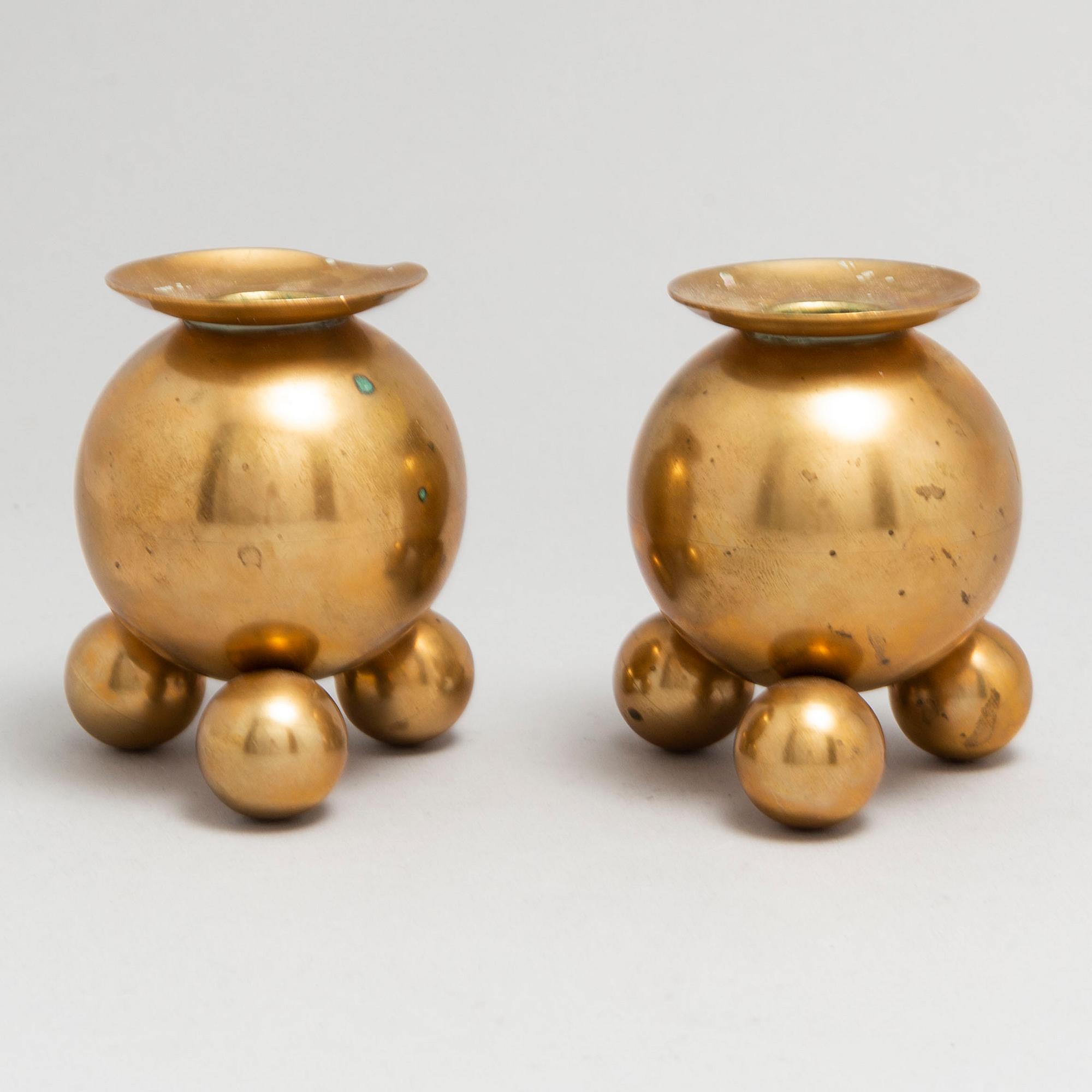 A pair of brass candlesticks from Gusum, circa 1900.