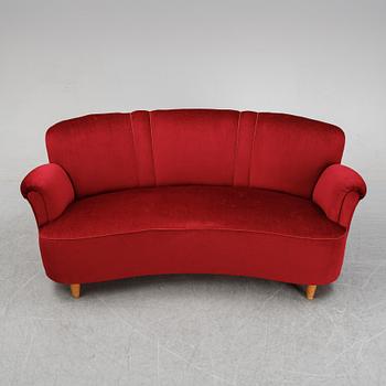 A first half of the 20th Century sofa with velvet upholstery.