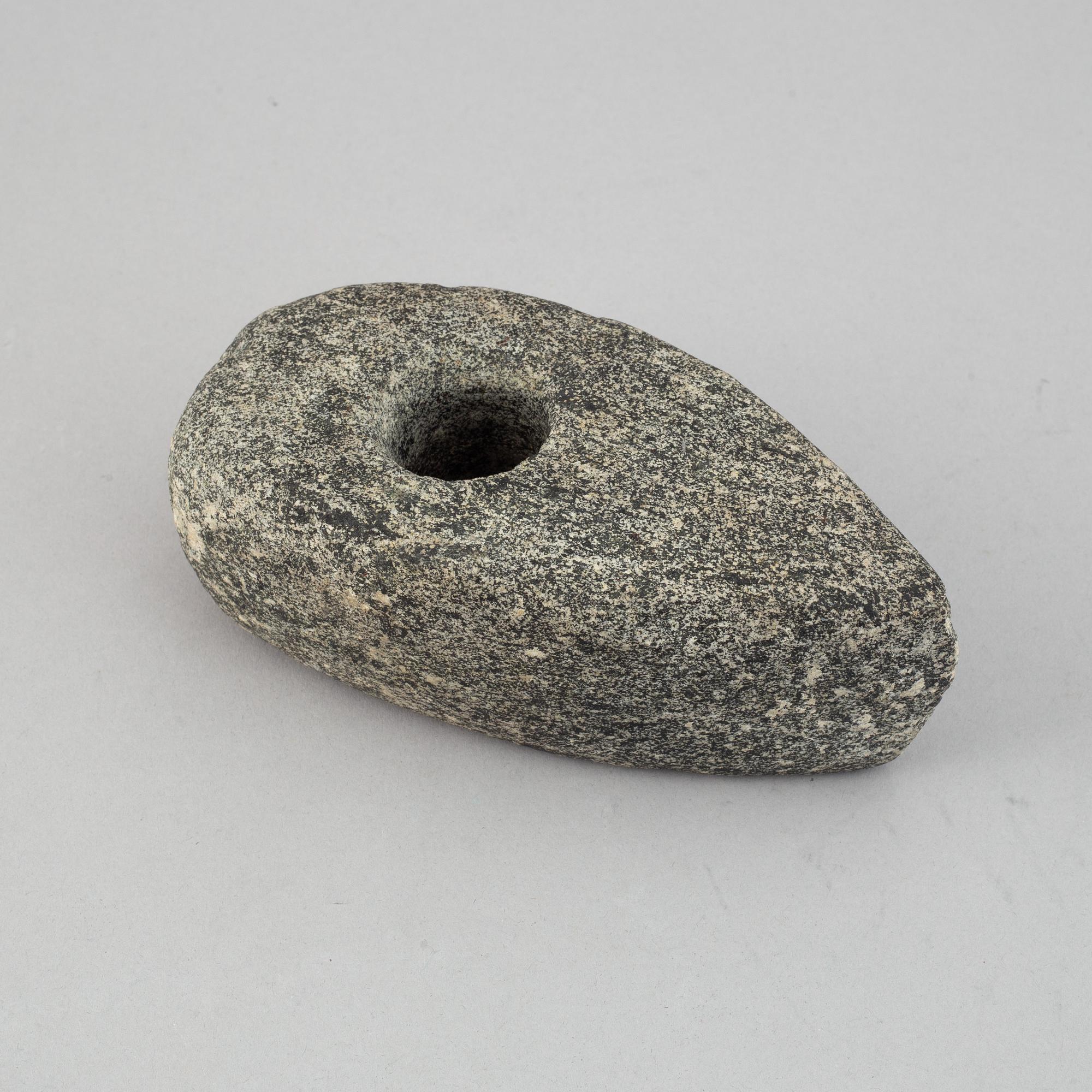 A collection of five neolithic objects.