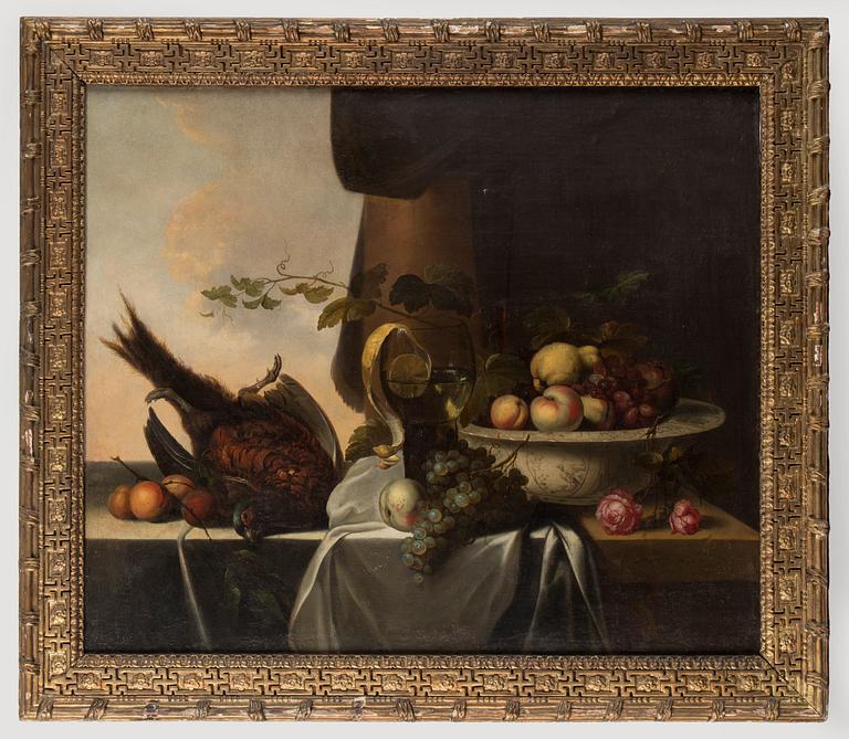 Michiels Simons (Simonis), Still life with pheasant, roemer with lemon and bowl with fruits.