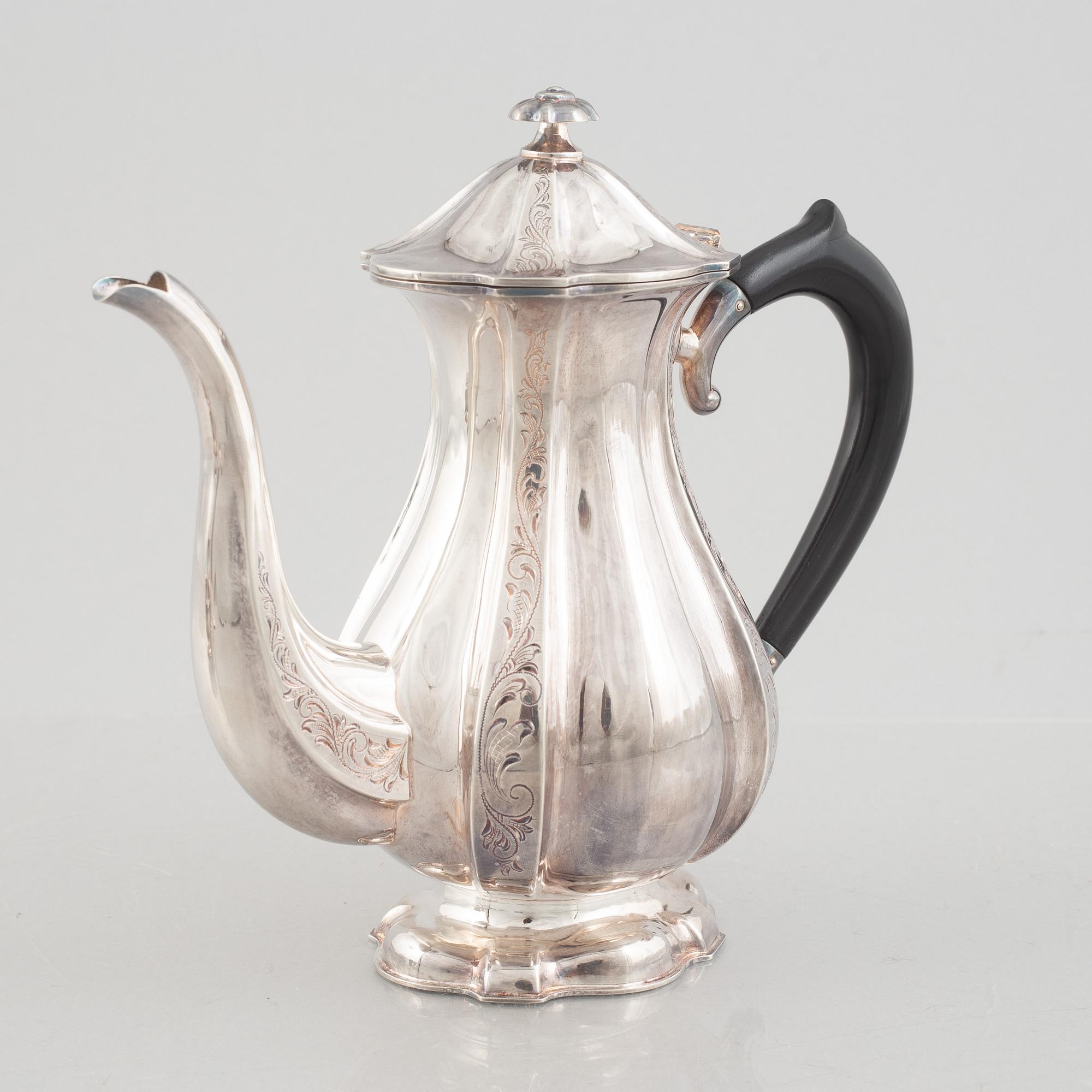 A silver coffee pot, creamer and sugarbowl, Swedish import marks, JL Hultman, circa mid-20th century.