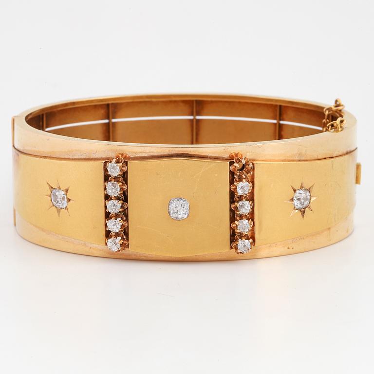 An 18K gold bracelet set with old-cut diamonds.