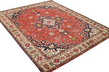 A Tabriz carpet, c. 335 x 257 cm.