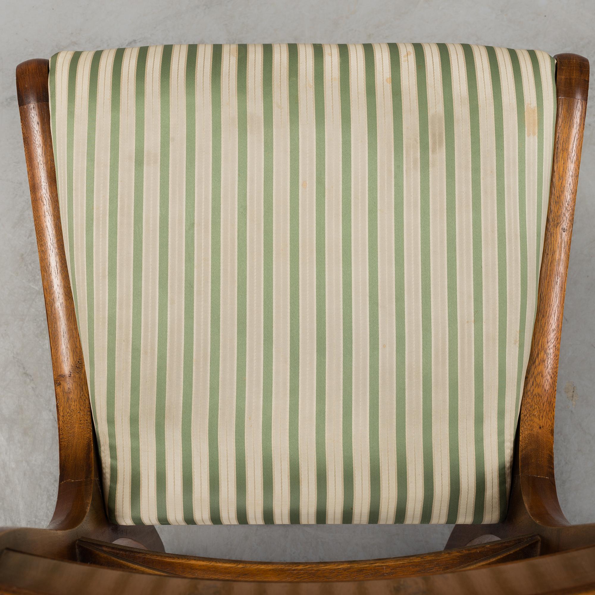A late 20th century English style dining table and six chairs.