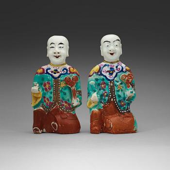 330. Two famille rose "laughing boys", Qing dynasty, circa 1800.