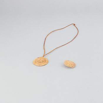 A Sami root brooch and pendant.