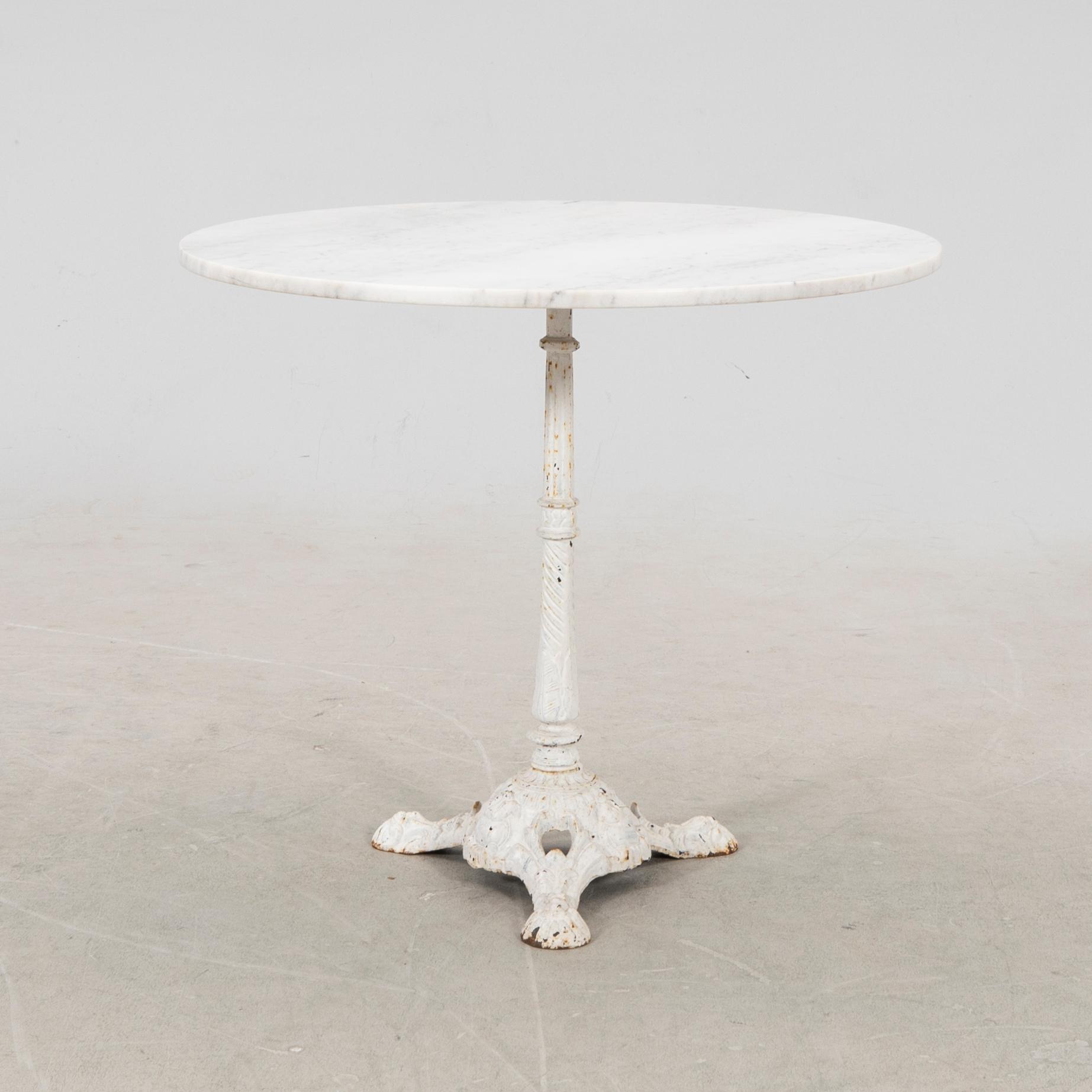 A marble and cast iron table 20th century.