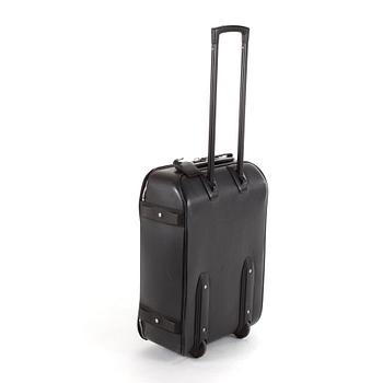 LOUIS VUITTON, a black leather suitcase, "Pegase".