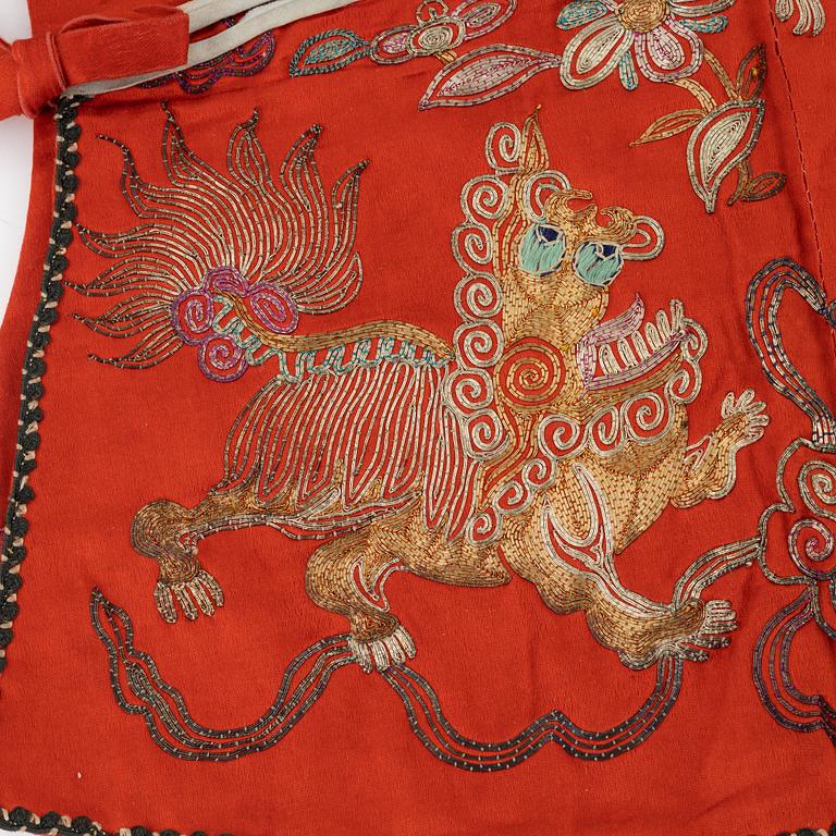 A Chinese embroidered silk jacket for children, late Qing dynasty, around 1900.