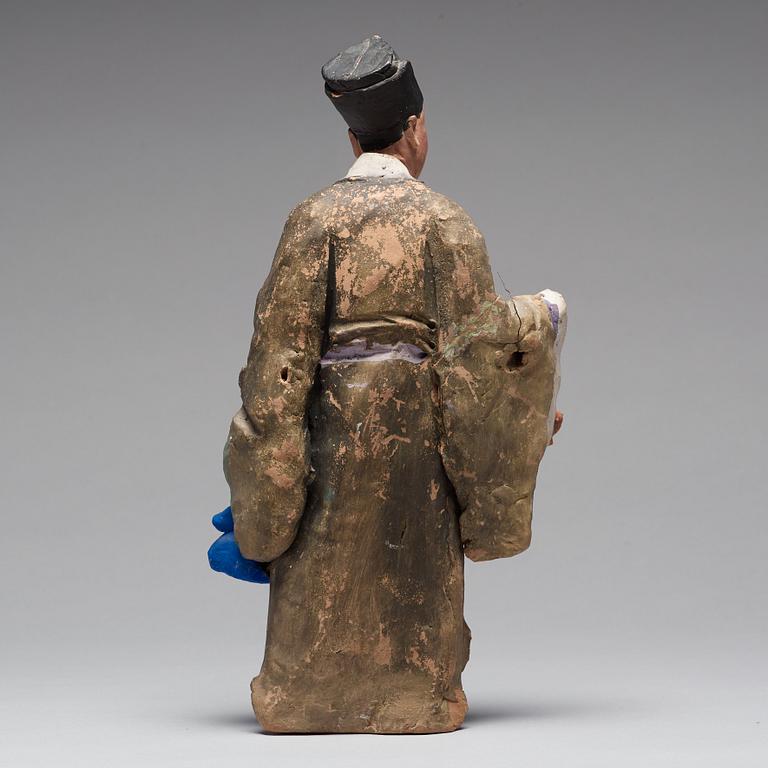 A clay figure of a chinese man, Qing dynasty, 19th Century.